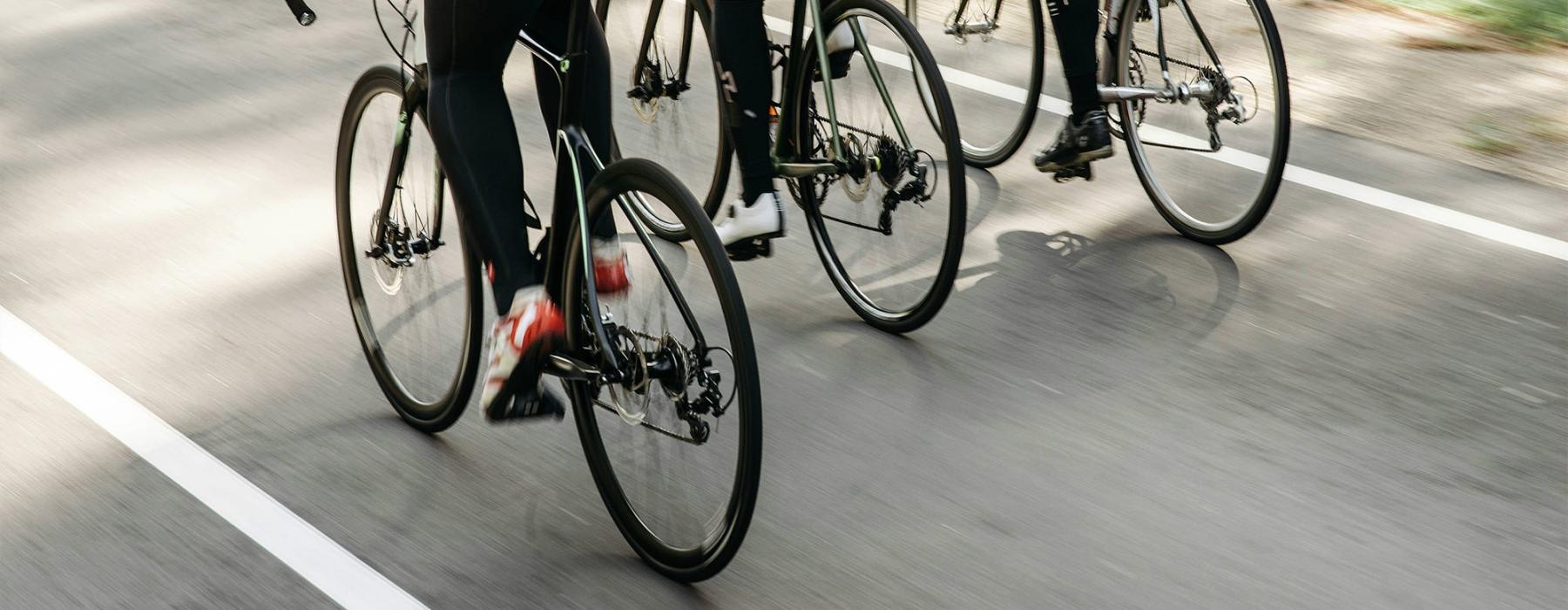 a group of people riding bikes